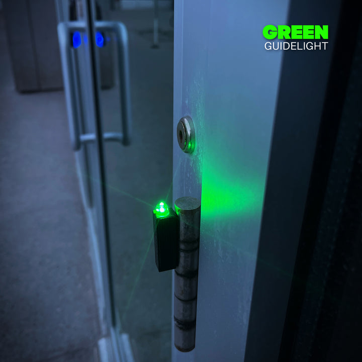 militaur green guidelight marker system on a door hinge